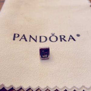 Pandora bracelet “L” charm